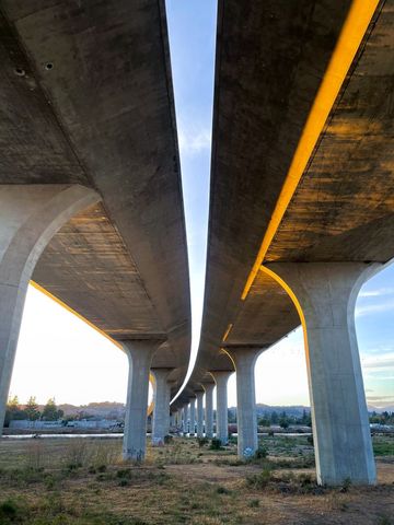 Beneath Urban Highway Overpass at Sunset