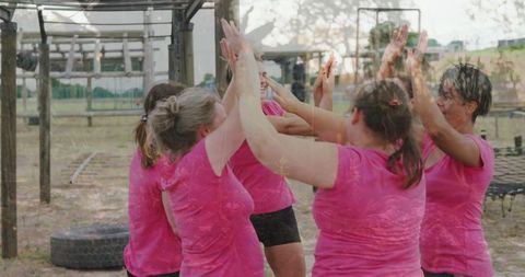Women celebrating success at outdoor fitness bootcamp