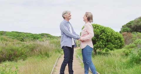 Senior Couple Embracing on Scenic Outdoor Path - Download Free Stock Images Pikwizard.com