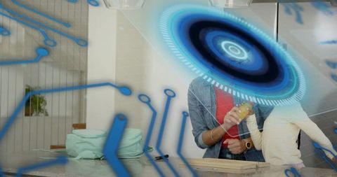 Woman in denim jacket guiding child with augmented reality overlay on kitchen countertop