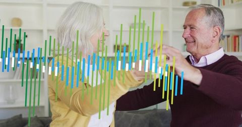 Senior couple dancing at home with waveform overlay conveying companionship and joy
