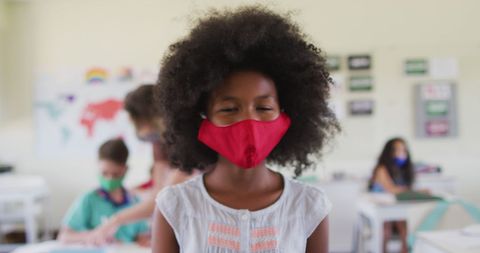 Schoolgirl Wearing Red Mask in Classroom for Pandemic Safety - Download Free Stock Images Pikwizard.com