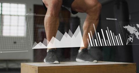 Male athlete performing box jump with fitness analytics hud and chalk dust