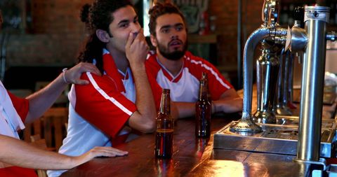 Friends Discussing Disappointing Sports Event at Bar - Download Free Stock Images Pikwizard.com