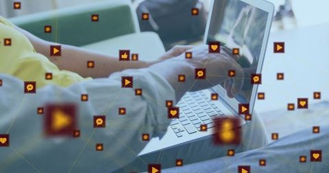 Person using laptop with social media interaction icons