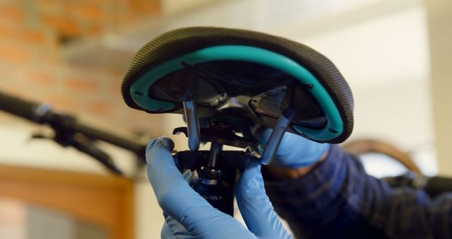 Mechanic Adjusting Bicycle Seat With Gloved Hands - Download Free Stock Images Pikwizard.com