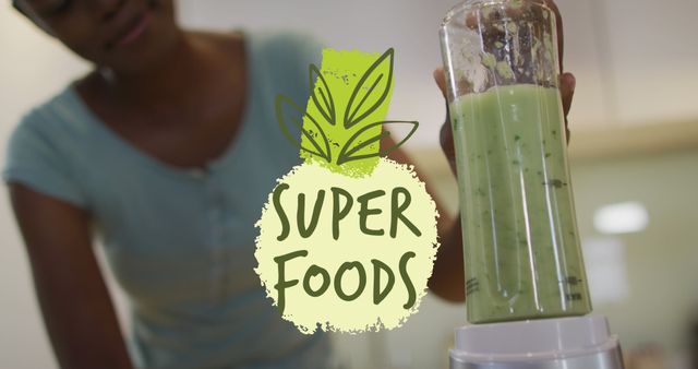 Person Blending Green Smoothie with Superfood label, Promoting Healthy Lifestyle - Download Free Stock Images Pikwizard.com