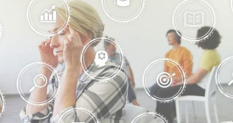 Woman Pressing Temples During Group Therapy Session with Digital Icon Overlay