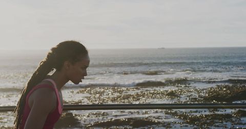 Woman Jogging on Seaside Promenade at Sunrise - Download Free Stock Images Pikwizard.com