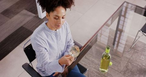 Woman Enjoying Glass of White Wine at Office Desk - Download Free Stock Images Pikwizard.com
