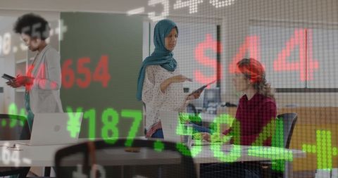 Diverse Team Analyzing Financial Data in Business Office