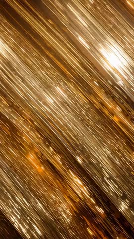 Vertical video showing gold fringe curtain swaying and sparkling under moving stage lights