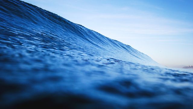 Close-Up of Ocean Wave at Dawn in Tranquil Blue Waters - Download Free Stock Photos Pikwizard.com