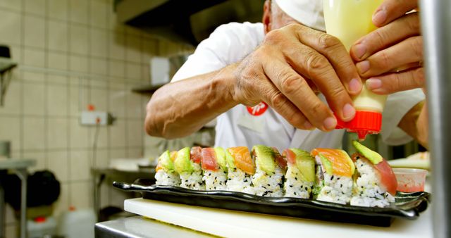 Chef Preparing Sushi with Precision in Restaurant Kitchen - Download Free Stock Images Pikwizard.com