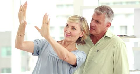 Caucasian Middle-Aged Couple Collaborating, Expressive Hand Gestures - Download Free Stock Images Pikwizard.com