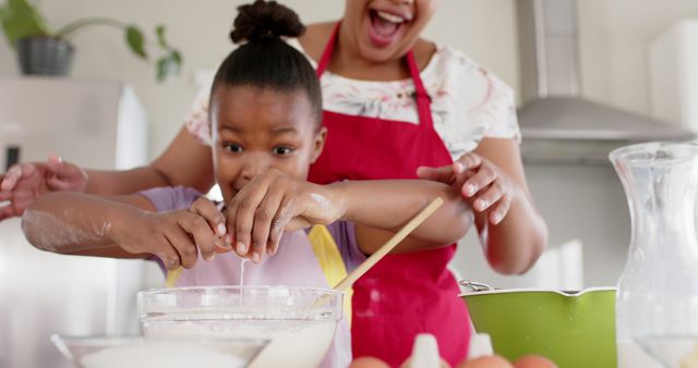 Mother and Daughter Baking Together Excitedly in Kitchen - Download Free Stock Images Pikwizard.com