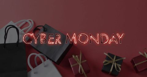 Cyber Monday Shopping Bags and Gift Boxes on Red Background