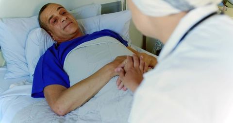 Nurse providing comforting care to hospitalized patient