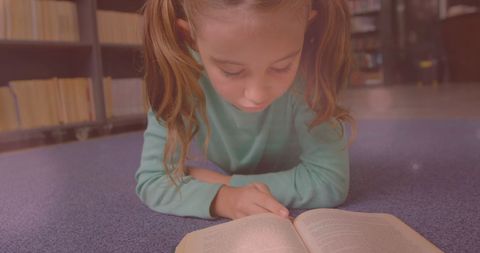 Curious Schoolgirl Immersed in Reading Book in Library - Download Free Stock Images Pikwizard.com