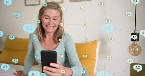 Smiling mature woman using smartphone with ai network overlay in cozy bedroom