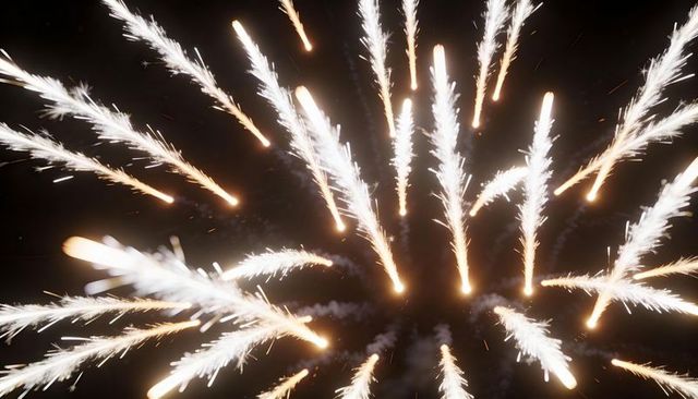 Radial golden firework bursts lighting night sky with glowing cores and spark trails