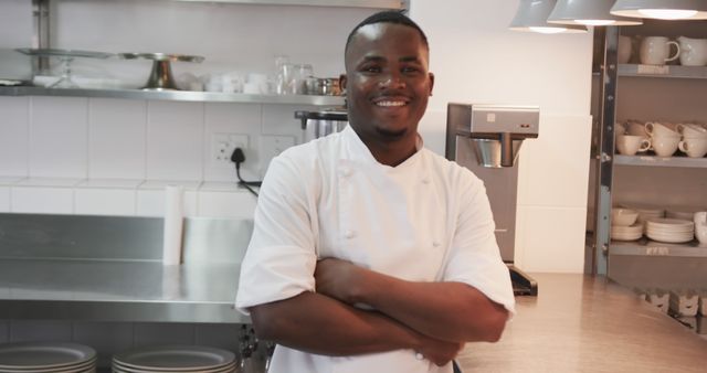 Confident Chef Smiling in Industrial Kitchen - Download Free Stock Images Pikwizard.com