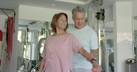 Senior Couple Exercising Together in Home Gym, Promoting Active Lifestyle