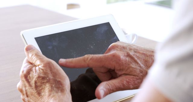 Senior Using Tablet Computer for Touchscreen Interaction - Download Free Stock Images Pikwizard.com