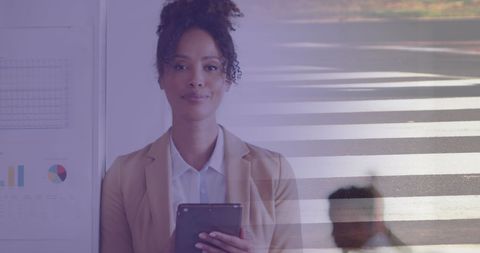 Confident Businesswoman Maps Success in Urban Setting