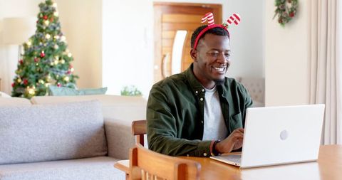 Festive man working from home during holidays