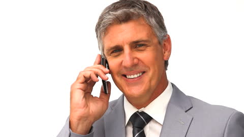 Senior Businessman Smiling While Speaking on Smartphone