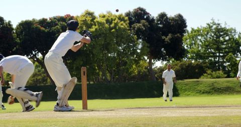 Cricket Match Action with Wicket Keeper and Batsman on Sunny Day - Download Free Stock Images Pikwizard.com