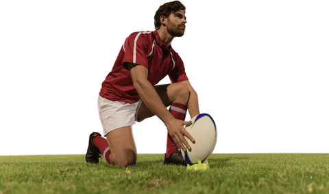 Male rugby player positioning ball on grass field transparent background