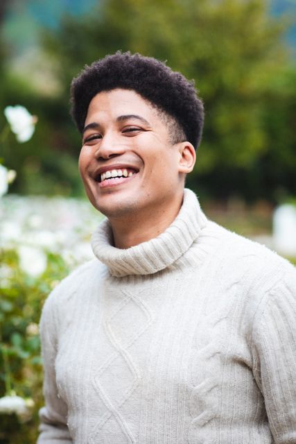 Close-up portrait of biracial cheerful mid adult man wearing turtleneck sweater - Download Free Stock Photos Pikwizard.com