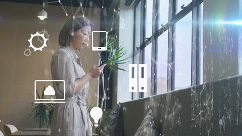 Businesswoman Using Smartphone in High-Tech Office with Digital Interface