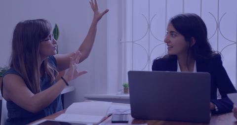 Colleagues Discussing Project in Office