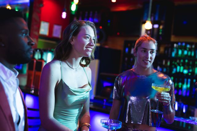 Happy caucasian female friends having fun in club - Download Free Stock Photos Pikwizard.com
