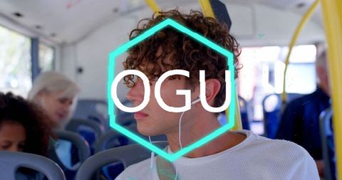 Young man listening to music on public transit bus