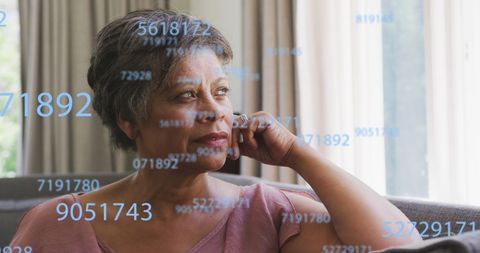 Senior Woman Reflecting on Numbers and Finance Concepts