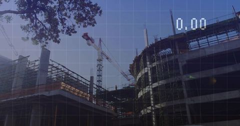 Urban construction site with circular concrete core and cranes