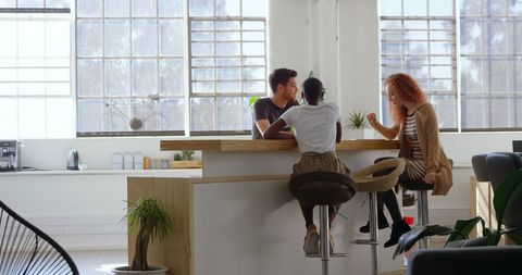 Diverse Team Enjoying Collaborative Discussion in Modern Office - Download Free Stock Images Pikwizard.com