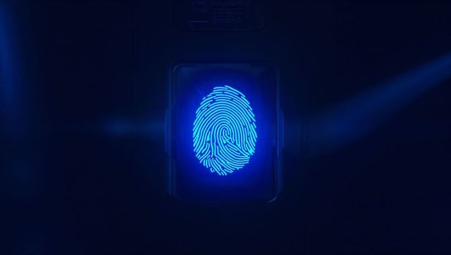 Futuristic blue fingerprint hologram on biometric scanner