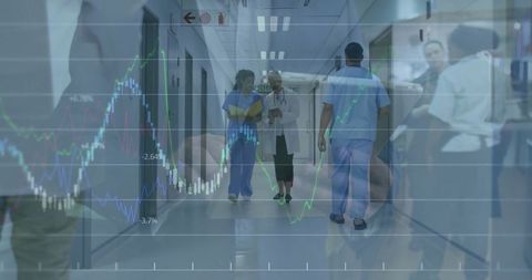 Senior Doctor and Nurse Analyzing Health Data in Hospital Corridor