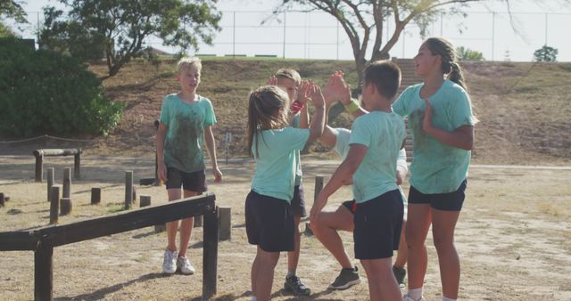 Children High-Fiving Outdoors During Team Game - Download Free Stock Images Pikwizard.com