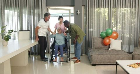 Diverse Group Welcoming Patient to Physiotherapy Center