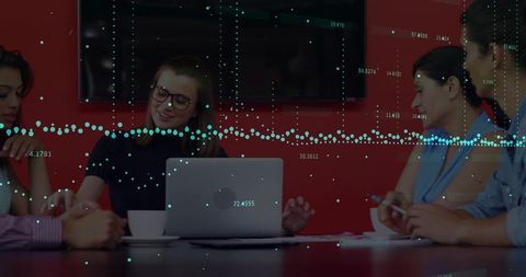 Businesswoman leading data-driven team meeting with laptop and analytics overlay