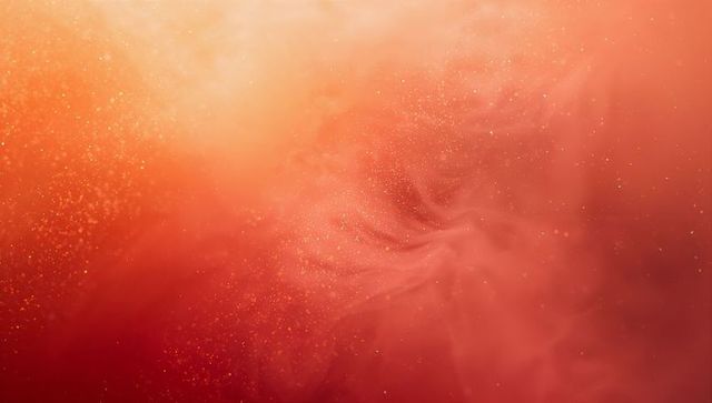 Swirling red-orange cosmic nebula with gold dust, ethereal gradient and glitter bokeh