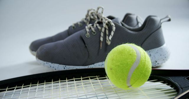 Tennis Equipment Featuring Racer Green Sneakers and Racket - Download Free Stock Images Pikwizard.com