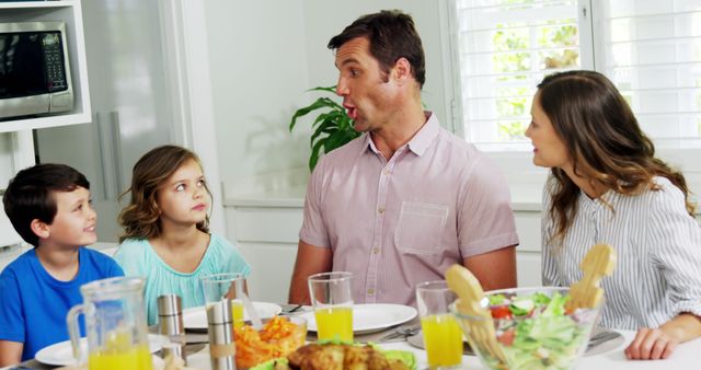 Family Having Fun Conversation During Meal at Home - Download Free Stock Images Pikwizard.com