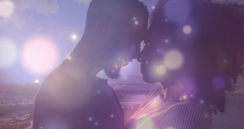 Romantic African American Couple Embracing by Ocean